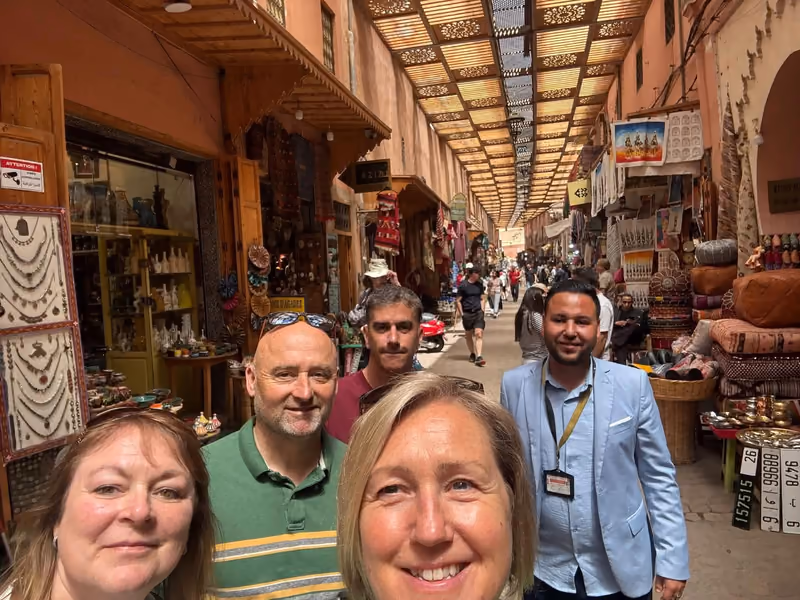 A group selfie under the latticed roof of the Marrakech souk