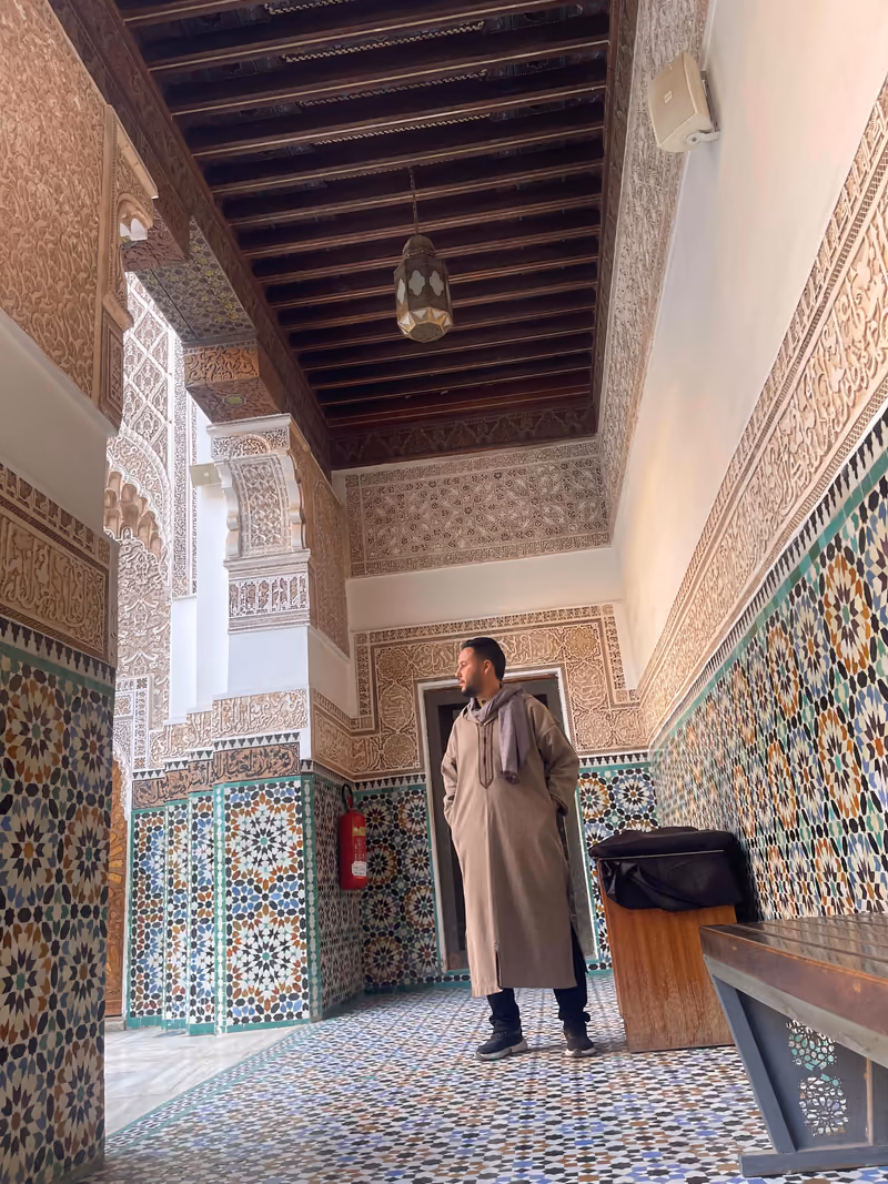 Tiled courtyard of a historic madrasa with zellij mosaics